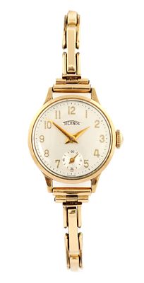 A 9ct GOLD LADIES' WRISTWATCH with 9ct gold case with silvered dial and second subsidiary dial 