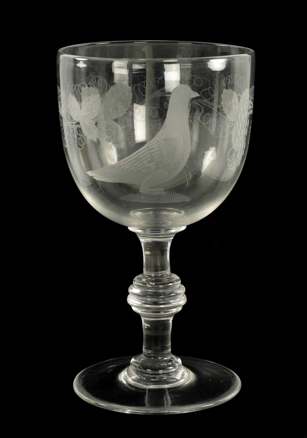 AN OVERSIZED 19TH CENTURY GLASS ENGRAVED GOBLET the body decorated