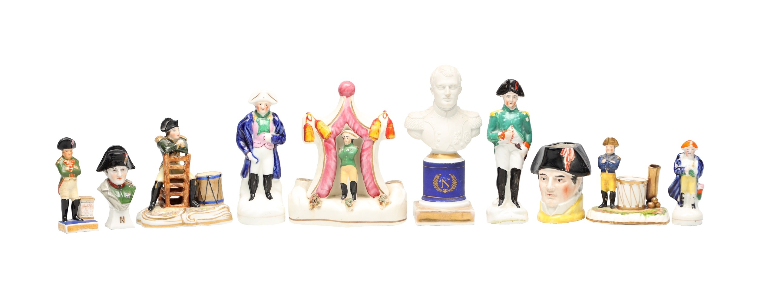 A COLLECTION OF TEN 19TH CENTURY POTTERY FIGURES OF NAPOLEON BONAPARTE
