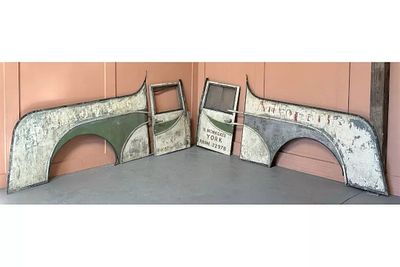 A COLLECTION OF PAINTED METAL VEHICLE PANELS AND DOORS comprising two wing panels and two doors 