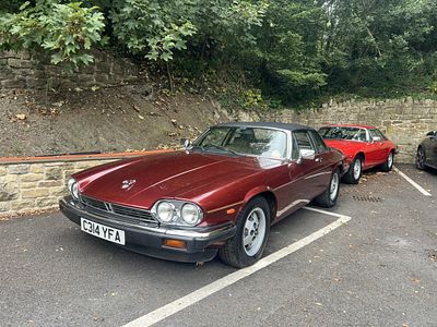 A 1985 JAGUAR XJ-SC 5.3-LITRE V12 CABRIOLET finished in metallic burgundy with a black 