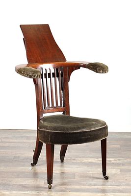 A GEORGE III MAHOGANY COCK FIGHTING CHAIR with adjustable book rest to the reverse, shaped arms 
