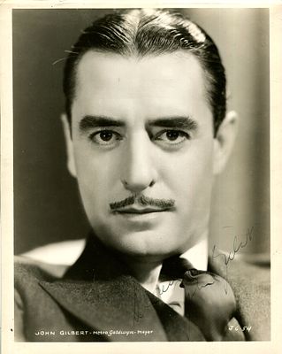 GILBERT JOHN: (1897-1936) American actor of the silent screen era. Vintage signed sepia 8 x 10 