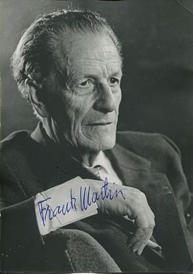 MARTIN FRANK: (1890-1974) Swiss composer. Signed 4 x 6 photograph of the composer seated in an 