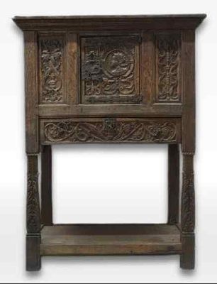 Oak credence, central portrait with decorative carving and wrought iron fittings, Southern 