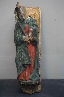Oak sculpture, the remains of a saint that originally formed part of a large double gate. 