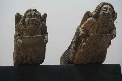 Pair of unusual oak consoles, rare architectural elements, each with a heraldic figurative 