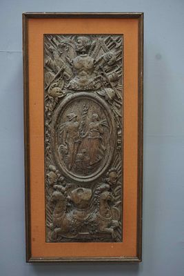Richly sculpted, framed bas-relief with special heraldic features, centrally two figures 