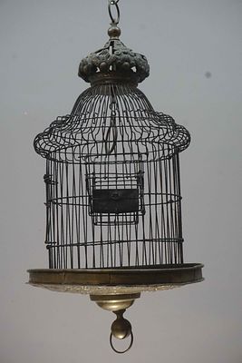 Unusual birdcage in brass and wrought iron, richly decorated bottom and crowned top, Flanders 