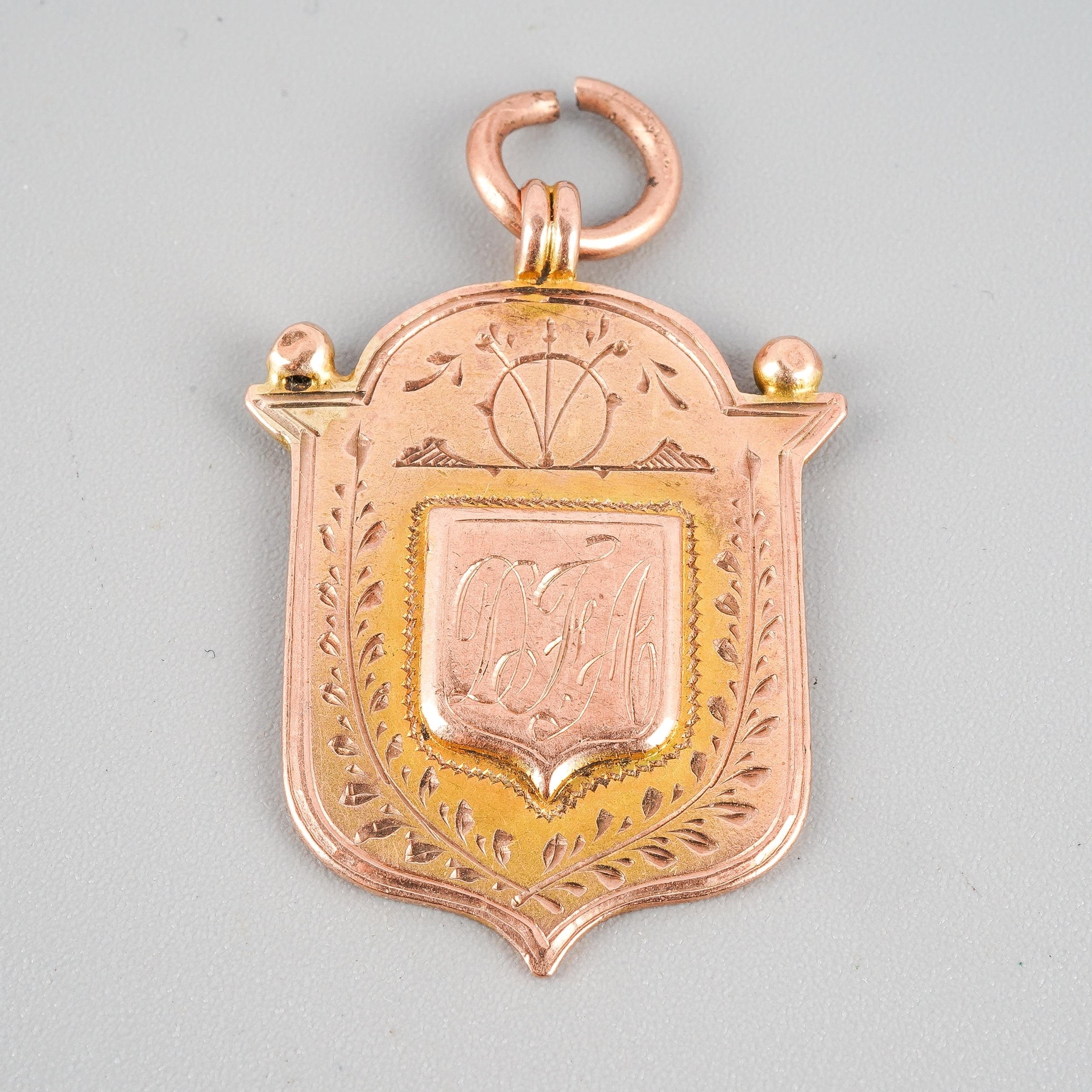 A 9ct rose gold shield fob, hallmarked to back, approx gross weight 6 grams