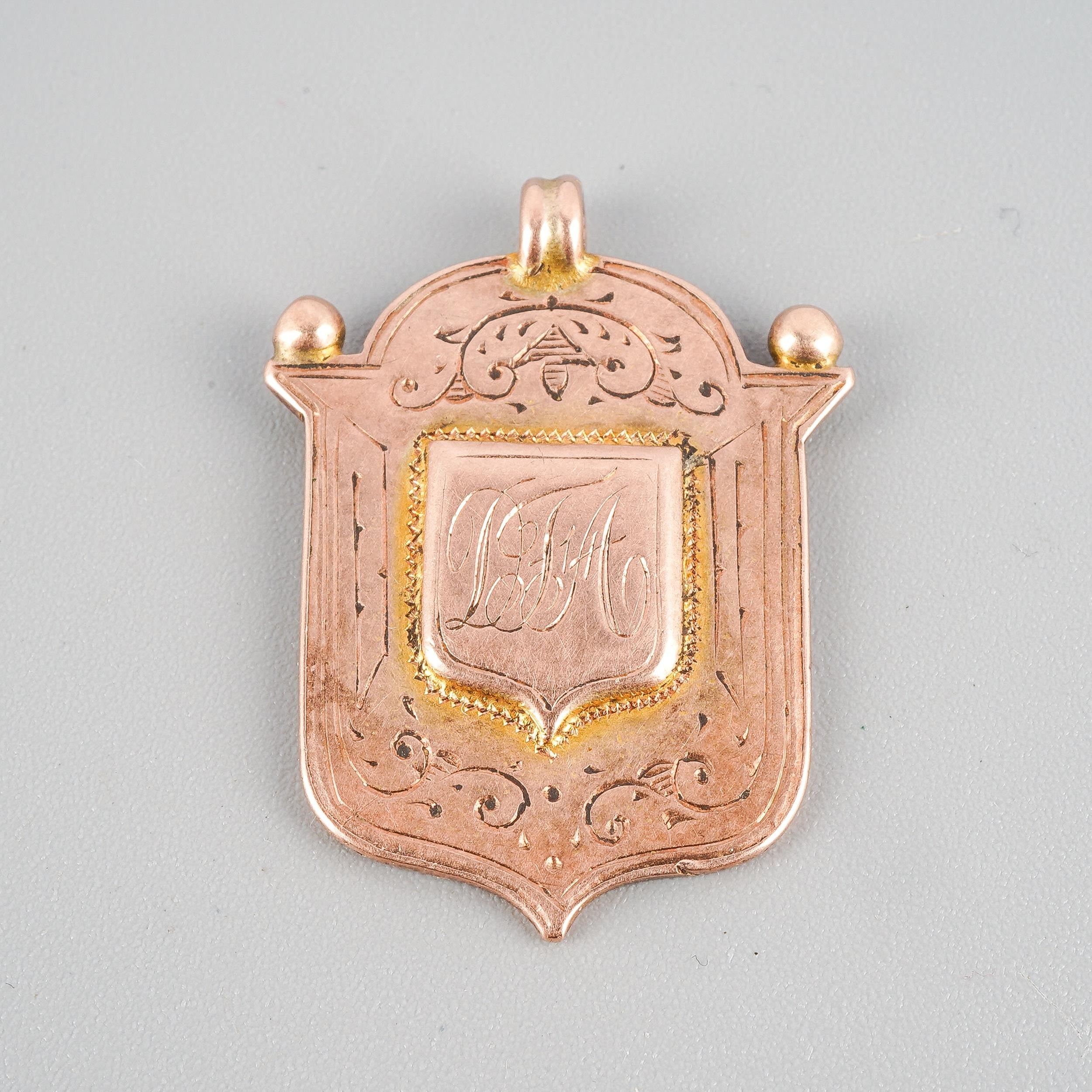 A 9ct rose gold shield fob, hallmarked to back, approx gross weight 6.2 grams
