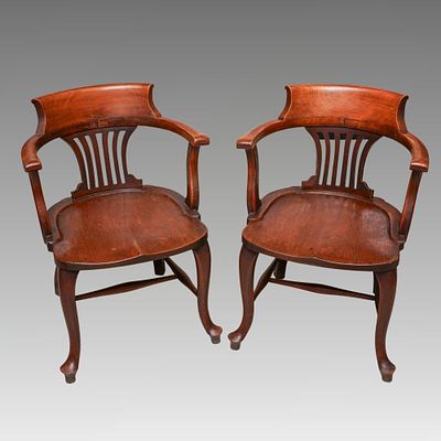 A pair of late 19th/early 20th Century mahogany tub back desk chairs [2]