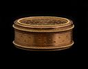 French gold Snuff Box. Circa 1785 French 18K gold round snuff box with guilloché decoration Image - 1