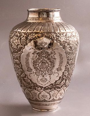Persian Silver Vase. Persian silver vase, decorated with figures, animals and floral motifs. 