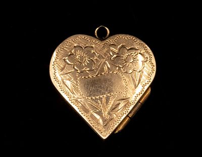 Gold Pendant. 14K gold heart shaped locket pendant. Engraved Decorations. Length: 22 mm. Weight:
