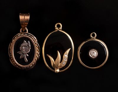 Gold Pendants. Collection of three 14K gold pendants set with onyx, two set with small diamonds.