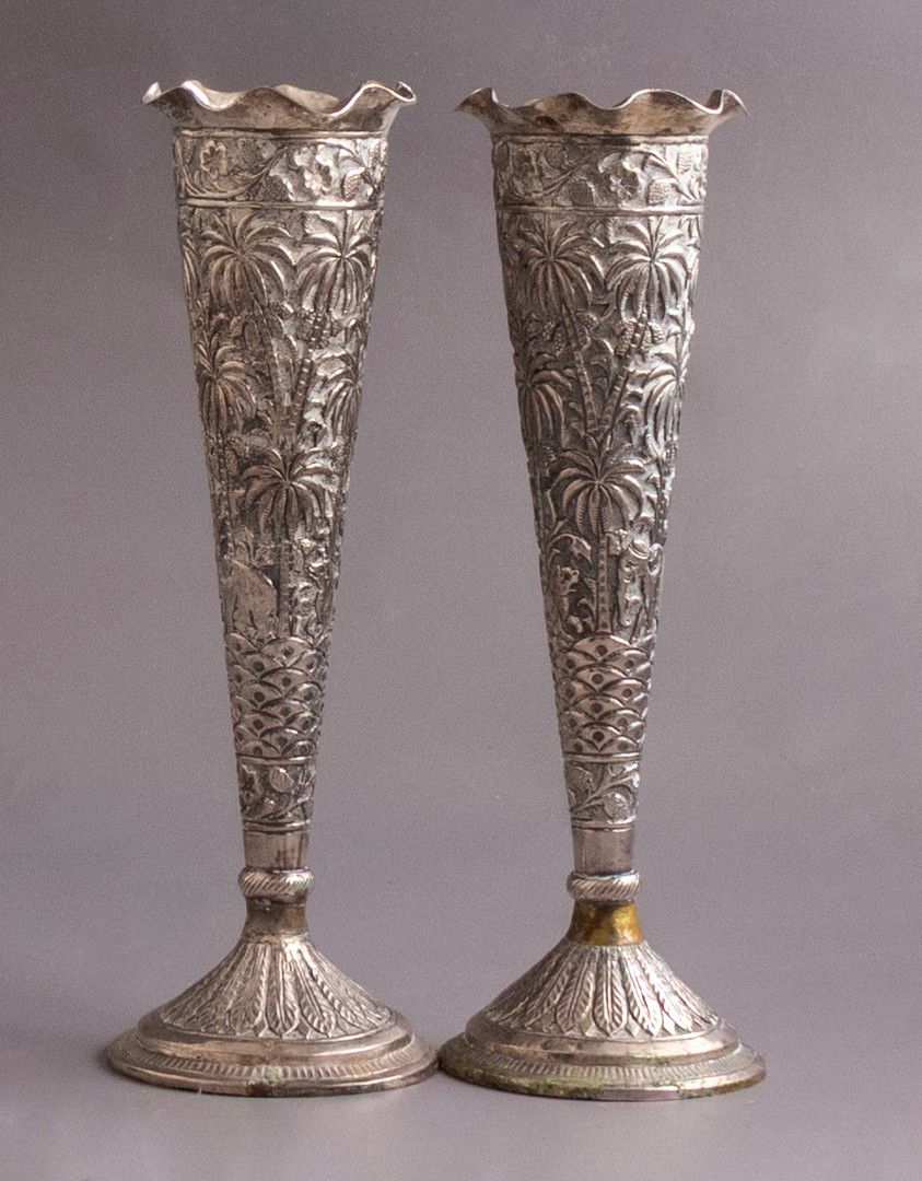 Indian Silver Vases. Pair of silver vases, India, 1900. Reliefs of floral and animal motifs. 