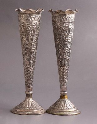 Indian Silver Vases. Pair of silver vases, India, 1900. Reliefs of floral and animal motifs.