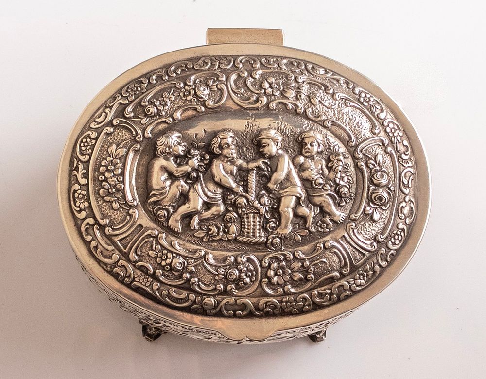European Silver Box. European sterling silver box, embossed with Putti figures and floral 