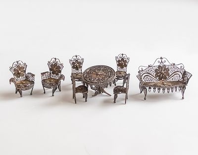 Miniature Silver Furniture. Set of miniature silver furniture including antique chairs, a table