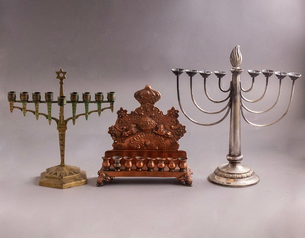 German Menorahs. Lot of 3 German menorahs, various materials including brass, copper and silver 