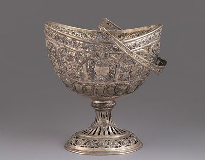 Silver basket, France, circa 1900. Decorated with open work and reliefs of putti figures and 