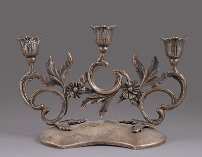 Silver Candelabra. 800 silver three-branched candelabra, decorated with open work featuring 