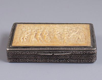 Silver Tobacco Box. 900 silver tobacco box, circa 1900. Decorated with carved work depicting 