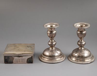 Silver Items. Lot of silver items, including a pair of weighted candlesticks and a German 