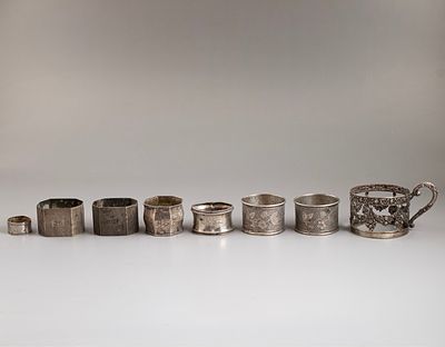 Silver Items, Germany. Lot of seven 800 silver napkin holders and a cup holder, Germany. 