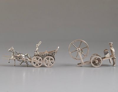 Silver Miniatures. 2 miniature silver figurines, a carriage with a horse and a craftsman. 