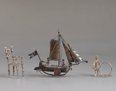 Silver Miniatures. 3 silver miniatures (800-925), a sailboat, a chair and a juggler. Height: 