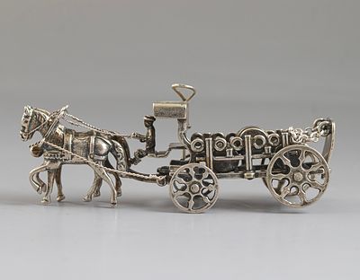 Dutch Silver Miniature. A miniature Dutch silver figurine, distributing wine/beer barrels in a 