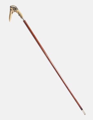 Antisemitic Cane. A walking stick with a grotesque carved handle depicting a Jewish figure. 