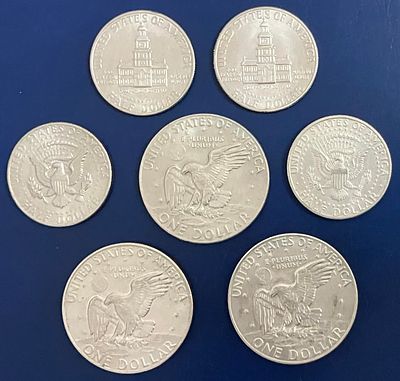 לוט 7 מטבעות ארצות הברית, שונים זה מזה : 
4 מטבעות &frac12; דולר (חצי דולר קנדי) ; 