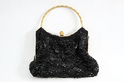 תיק אישה. הארנק הזה הוא פריט קוטור (Haute Couture) אמיתי מתור הזהב של האופנה הצרפתית. בשנות ה-30 