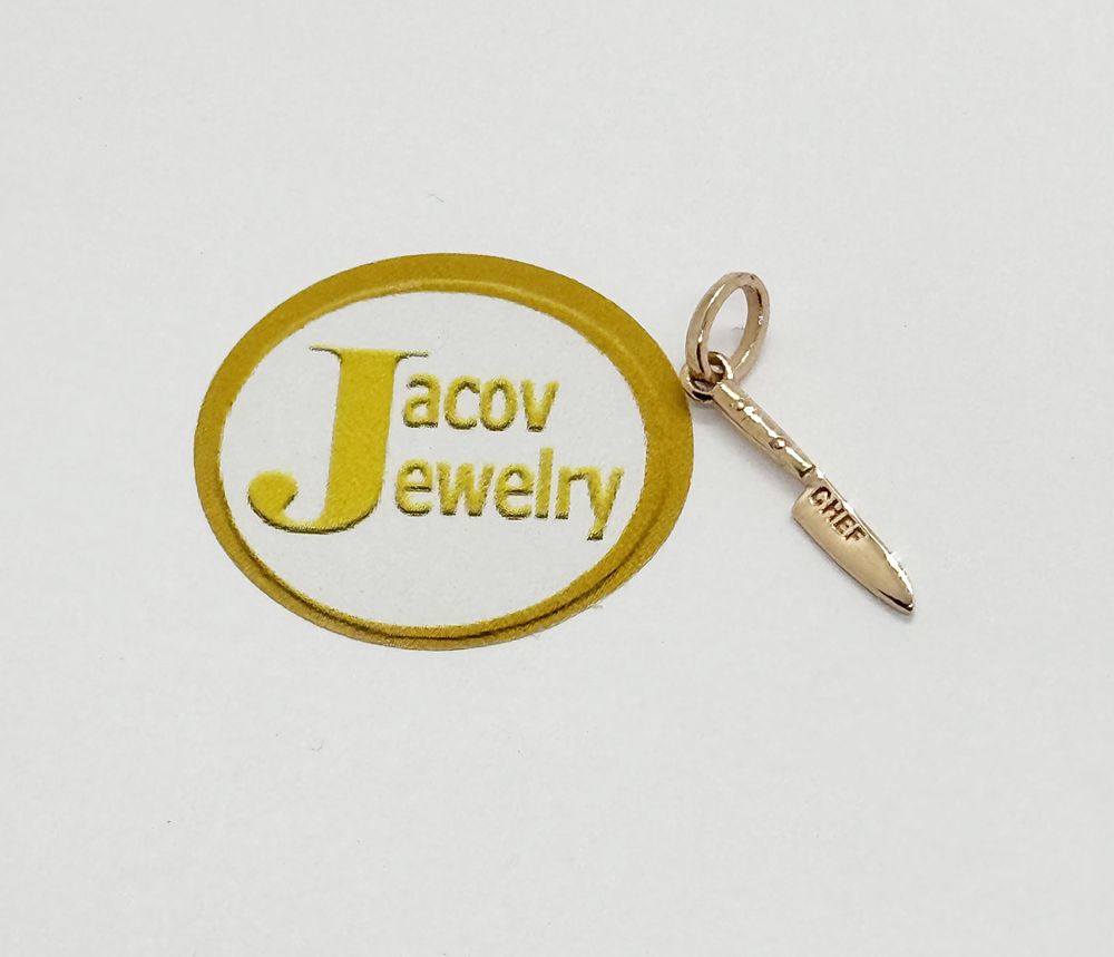 Knife model pendant in red gold rose gold 14K new.... Gold metal 
Purity: 14K 
Color: Red (Rose 