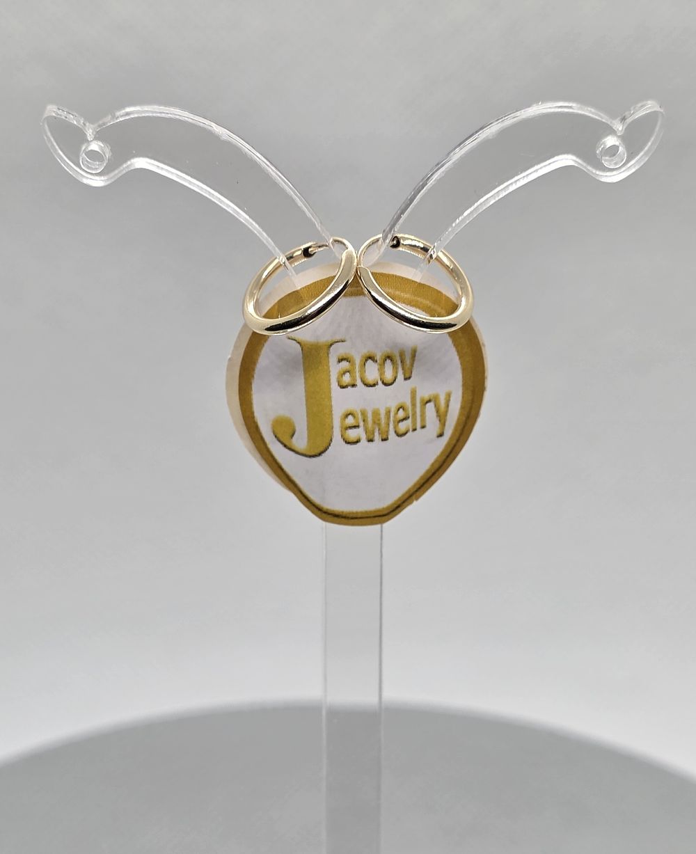 A pair of flexible hollow hoop earrings, diameter 12 mm, 
in 14K yellow gold, new.... Pair of 