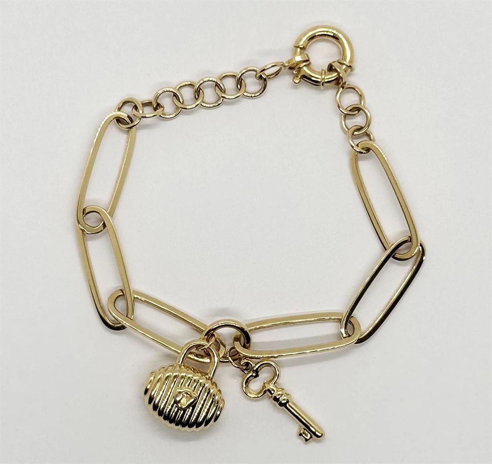 New 14K yellow gold hollow charm bracelet 
with lock and key.... *The bracelet has a lock and 