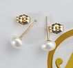 A pair of new white-toned natural pearl earrings 
in 14K yellow gold.... *A pair of natural 