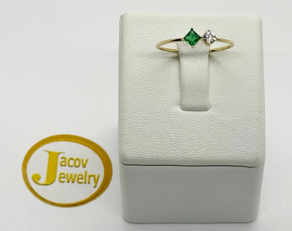 A green rhombus and solitaire model ring studded with zircon stones New 14K yellow gold.... Gold 