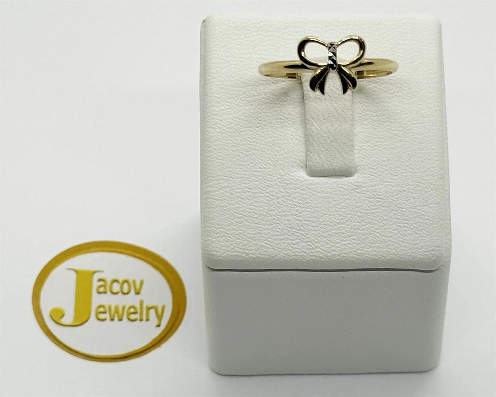 New 14K yellow gold smooth bowtie model ring.... Gold metal 
Purity: 14K 
Color: Yellow 
Weight 