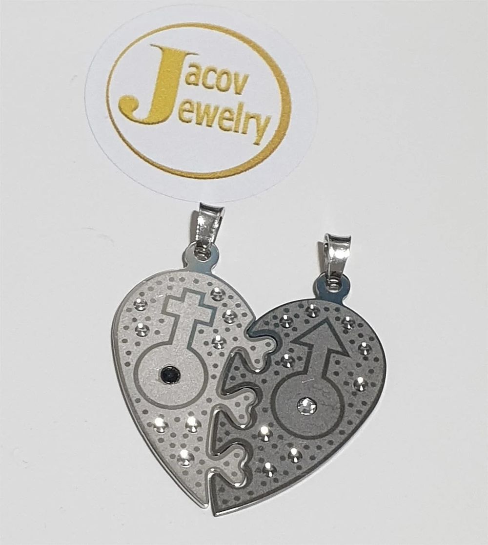 Male and female heart pendant studded with 925 silver zircon stones new....
The pendant is 
