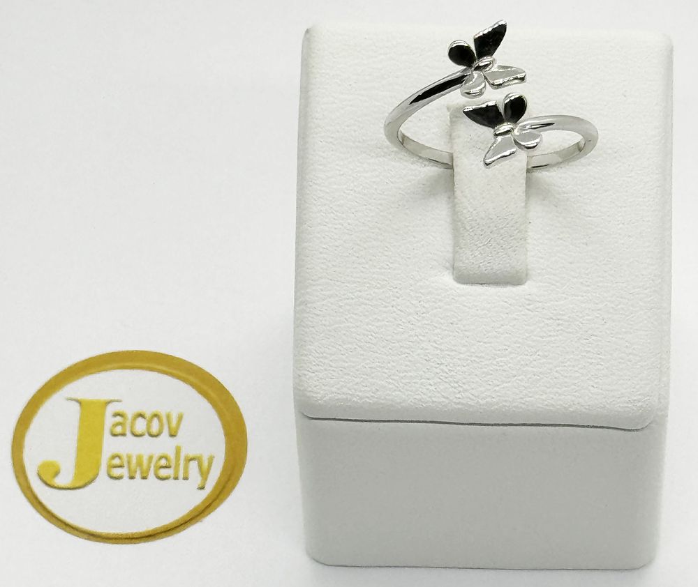 A flexible open ring with a butterfly model in a special design 
New 14K white gold.... Gold 