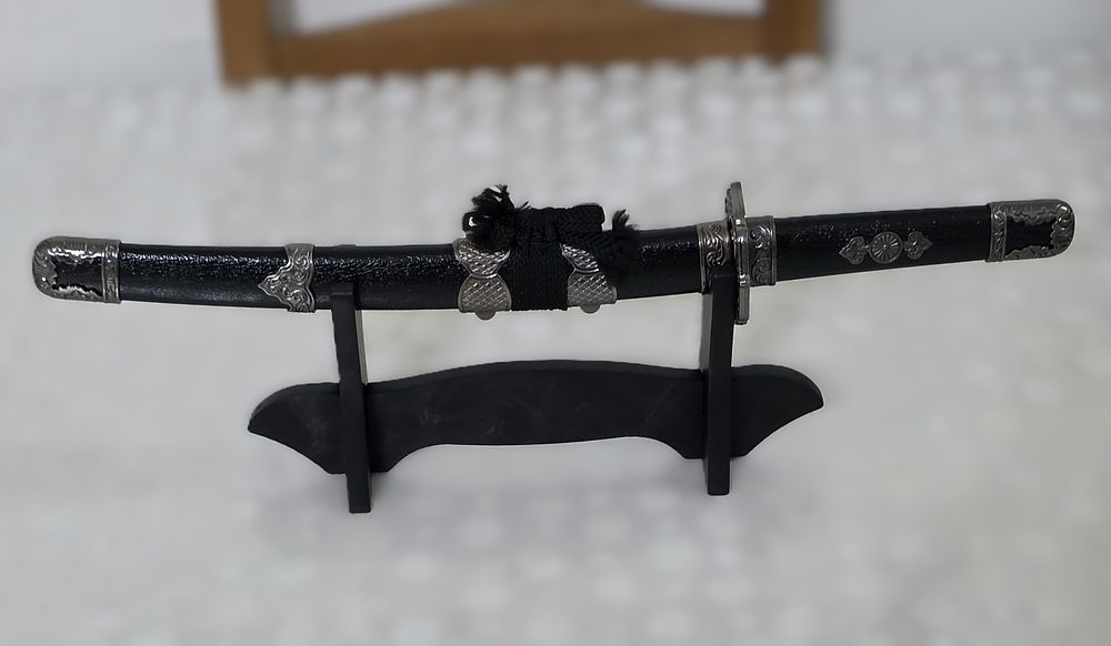 Samurai sword Hattori Hanzo on a stand designed for a new sideboard or office.... Sword 