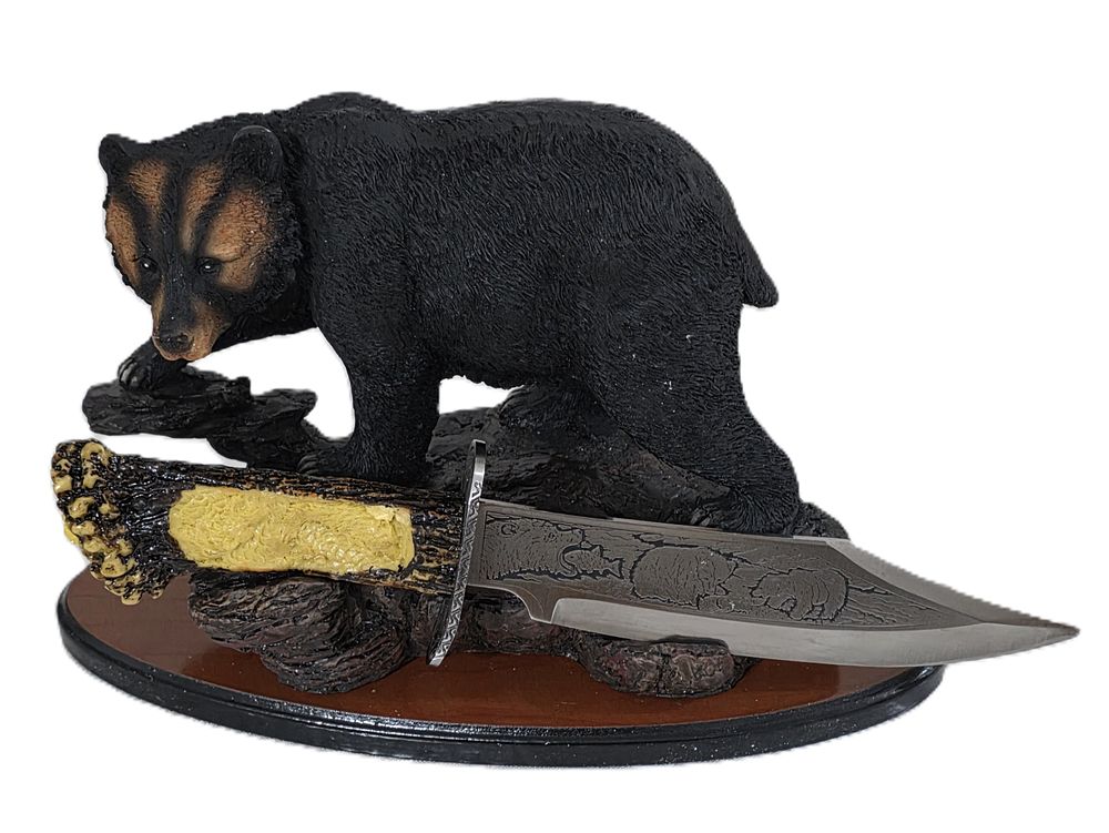A hunting knife designed on a grizzly bear stand for a new buffet or office.... Knife 