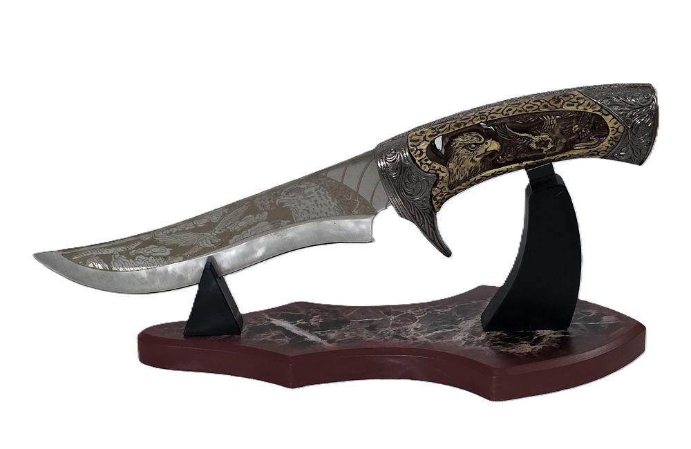A hunting knife designed on an American eagle stand 
for a new buffet or office.... Knife 