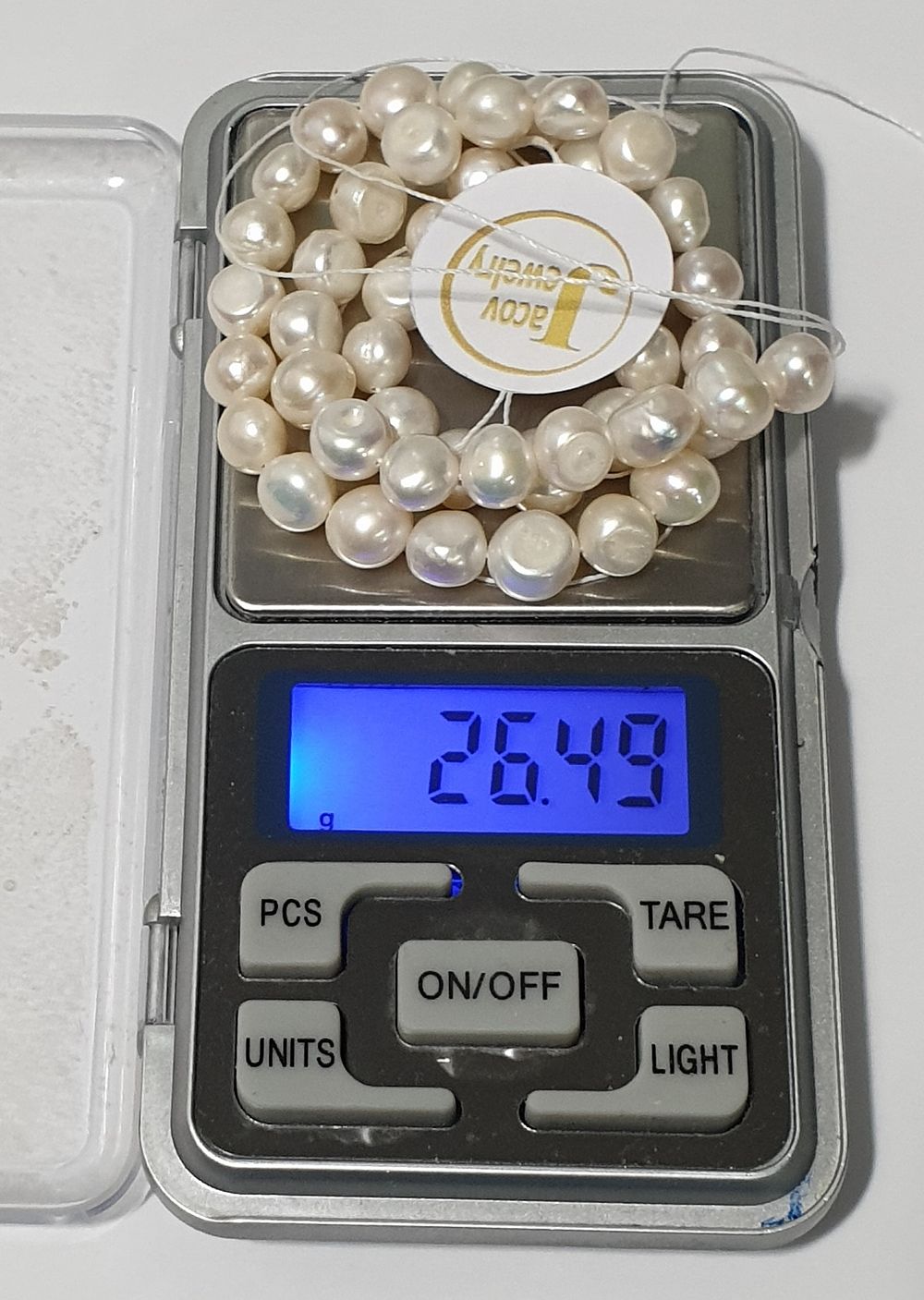 Natural pearl sleeve in a new white shade.... 
Freshwater farming (ready to work with 2 holes) 