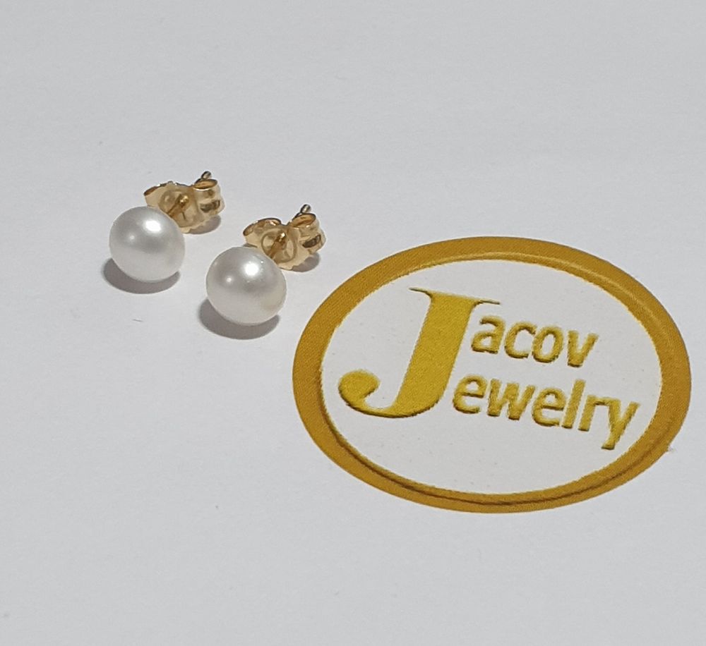 A pair of new natural pearl earrings in white tone in 14K yellow gold.... *A pair of new 