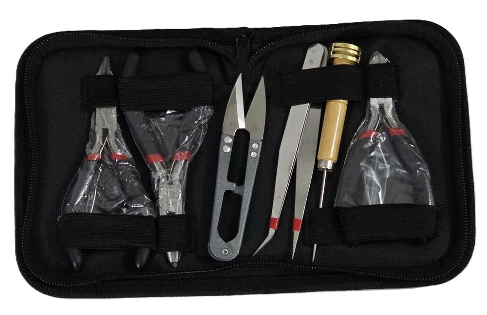 New black jeweler's tool kit.... Jeweler's Tool Set in a Bag 
Tool Details: 
1. Toothed Nose 